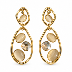 A pair of gold dangle earrings with oval and teardrop-shaped cream-colored stones and one faceted clear crystal, shown on a plain white background.