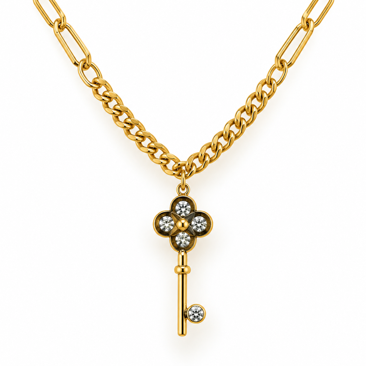 A gold chain necklace featuring a key-shaped pendant with a four-petal flower design set with clear round stones, photographed on a clean white background.