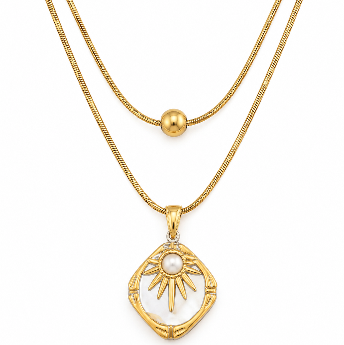 A gold double-layer necklace featuring a textured chain and a pendant with a white pearl sun motif set in a bamboo-like frame.