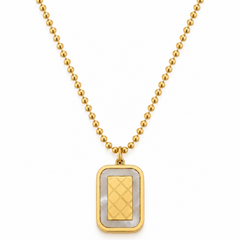 A gold ball-chain necklace with a rectangular pendant featuring a textured gold center and a white inlay border, shown on a plain white background.