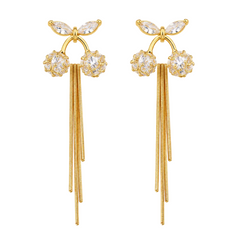 A pair of gold dangle earrings featuring clear marquise and round crystals at the top, with long textured gold chains hanging below, shown on a plain white background.