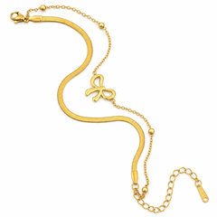 A gold snake chain bracelet with a central bow-shaped charm, a lobster clasp, and an extender chain with a tag, shown on a plain white background.