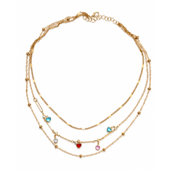 A gold multi-layered necklace featuring three delicate chains, small gold beads, and dangling heart charms in red, blue, pink, and clear crystal, displayed on a solid white background.