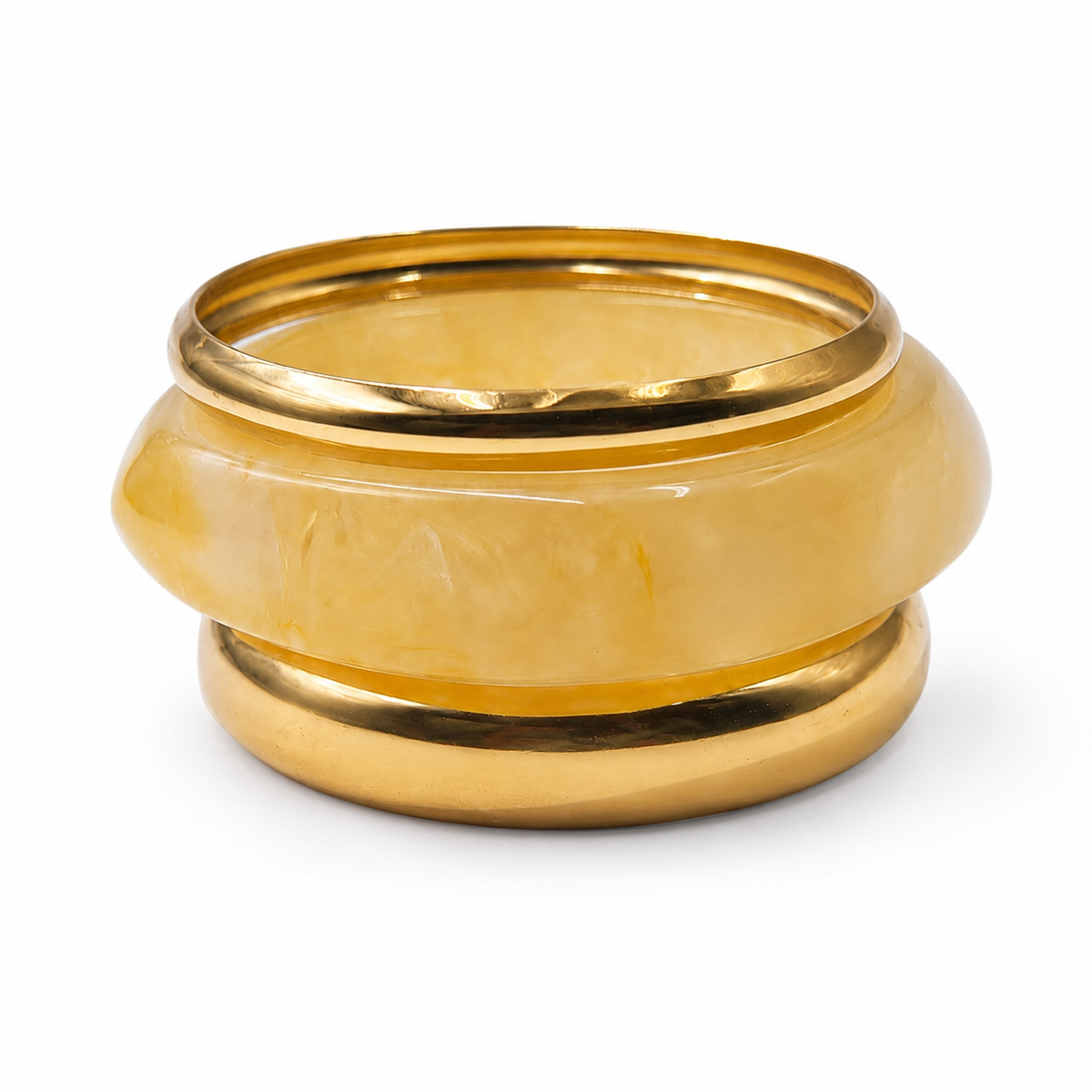 A gold-plated metal ring with a smooth, rounded translucent yellow stone inlay, photographed on a clean white background.