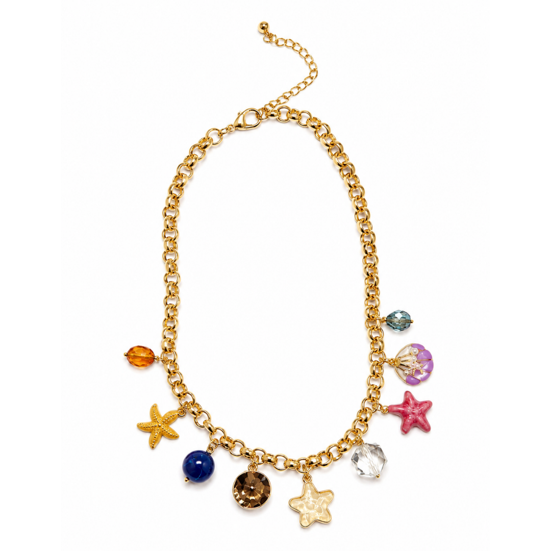 A gold-tone chain necklace with dangling charms including starfish, a seashell, a blue bead, a brown crystal charm, a clear faceted stone, and small colorful beads, shown on a plain white background.