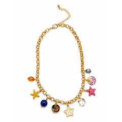 A gold-tone chain necklace with dangling charms including starfish, a seashell, a blue bead, a brown crystal charm, a clear faceted stone, and small colorful beads, shown on a plain white background.
