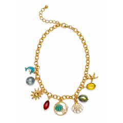 A gold-tone charm necklace featuring various sea-themed charms including a starfish, seashell, sun, dolphin, and colorful gemstones, displayed on a clean white background.