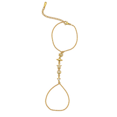 A gold chain anklet featuring a decorative central section with a small butterfly charm, a round clear stone, and a dangling teardrop-shaped chain loop at the bottom, shown on a plain white background.