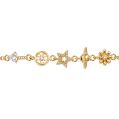 A gold-tone charm bracelet featuring multiple celestial and floral motifs, including a key, a flower, a star, a planet, and a sunflower, each adorned with small clear pavé stones, shown against a plain white background.