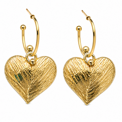 A pair of gold hoop earrings with textured heart-shaped dangles, shown on a plain white background.