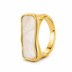 A polished gold signet-style ring with a large, irregularly shaped white mother-of-pearl inlay, shown on a clean white background.
