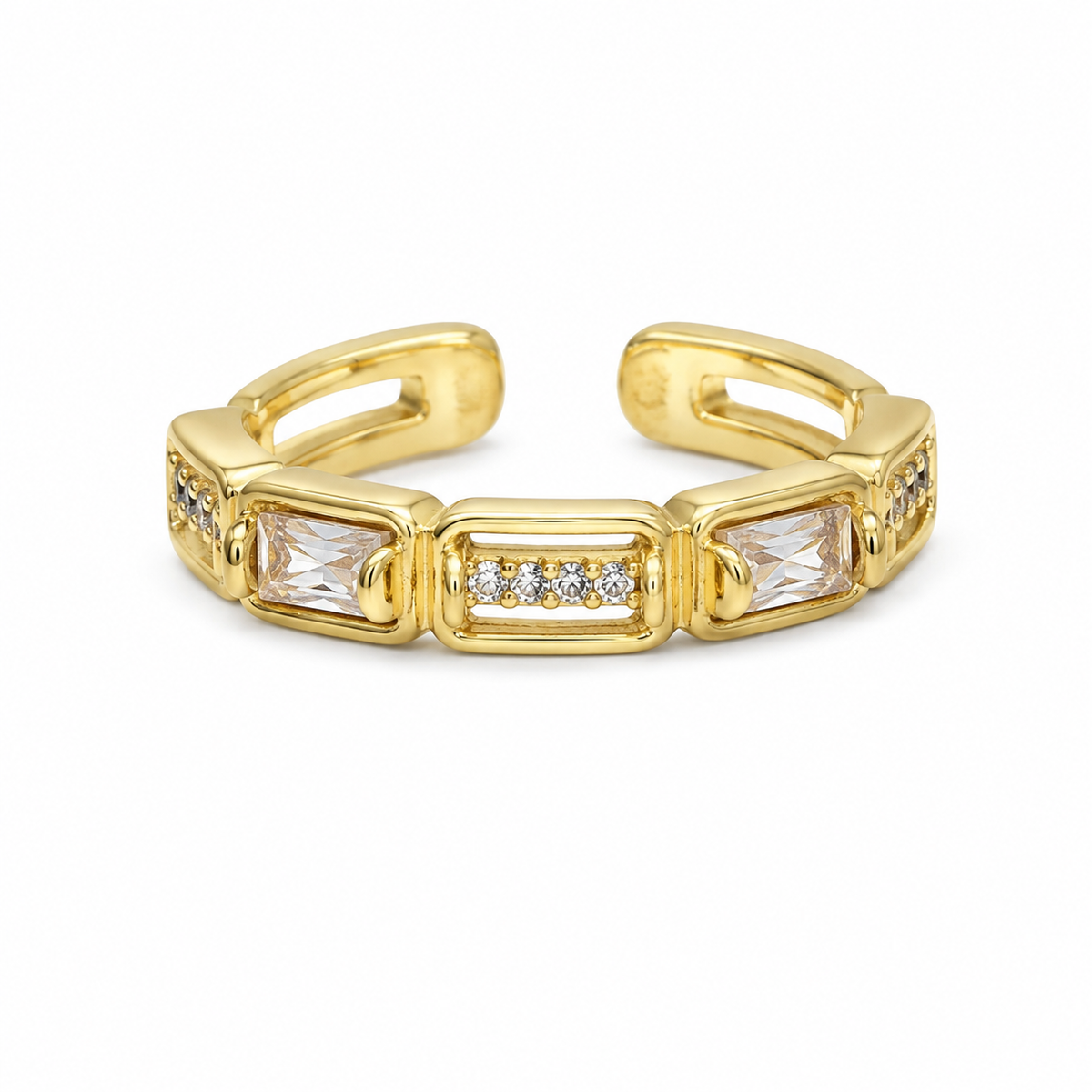 A gold-toned stretch ring featuring rectangular clear gemstones and small pavé-set clear stones, photographed on a clean white background.