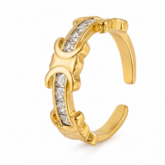 A gold-toned open cuff ring featuring three curved segments, each set with a channel of clear square-cut gemstones, shown on a plain white background.