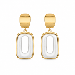 A pair of gold and white geometric drop earrings with rounded rectangular shapes, shown on a plain white background.