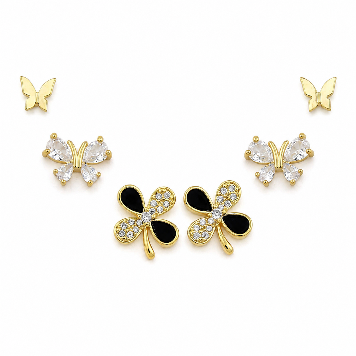 A set of butterfly stud earrings in gold-tone metal, featuring three pairs: two small gold butterfly studs, two medium gold butterfly studs with clear rhinestones, and two larger gold butterfly studs with black enamel inlays and clear rhinestones.