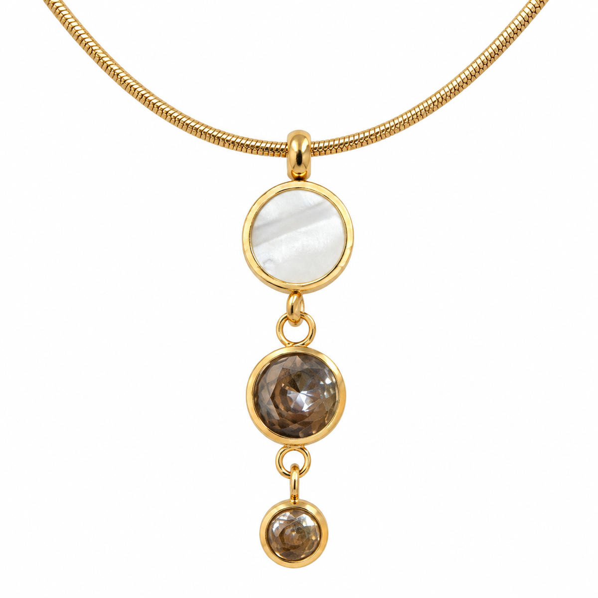 A gold snake chain necklace featuring a vertical dangle pendant with three round bezel-set stones: a large white mother-of-pearl disc at the top, and two smoky brown gemstone discs below, set against a plain white background.
