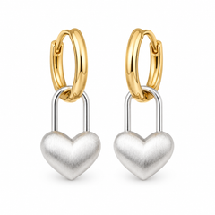 A pair of gold and silver hoop earrings with dangling heart-shaped padlock charms, shown on a clean white background.