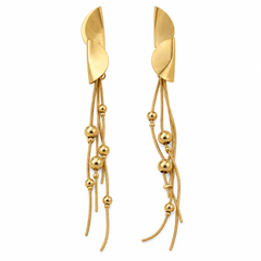 A pair of gold dangle earrings with abstract leaf-shaped posts and multiple thin strands ending in polished gold beads, shown on a plain white background.