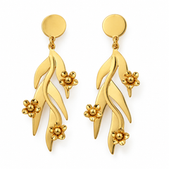 A pair of gold dangle earrings featuring stylized leaf and flower motifs, shown on a clean white background.