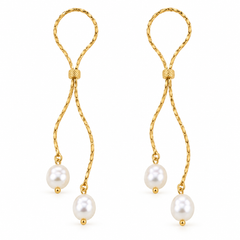 A pair of gold dangle earrings with twisted rope-like chains, small decorative knots, and three white pearl drops each, shown on a plain white background.