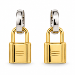 A pair of gold padlock-shaped hoop earrings with polished silver-toned hoops connected at the top, shown on a clean white background.