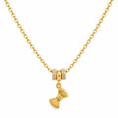 A gold chain necklace featuring a decorative charm with two textured gold beads and a dangling gold bow-shaped pendant, shown against a plain white background.