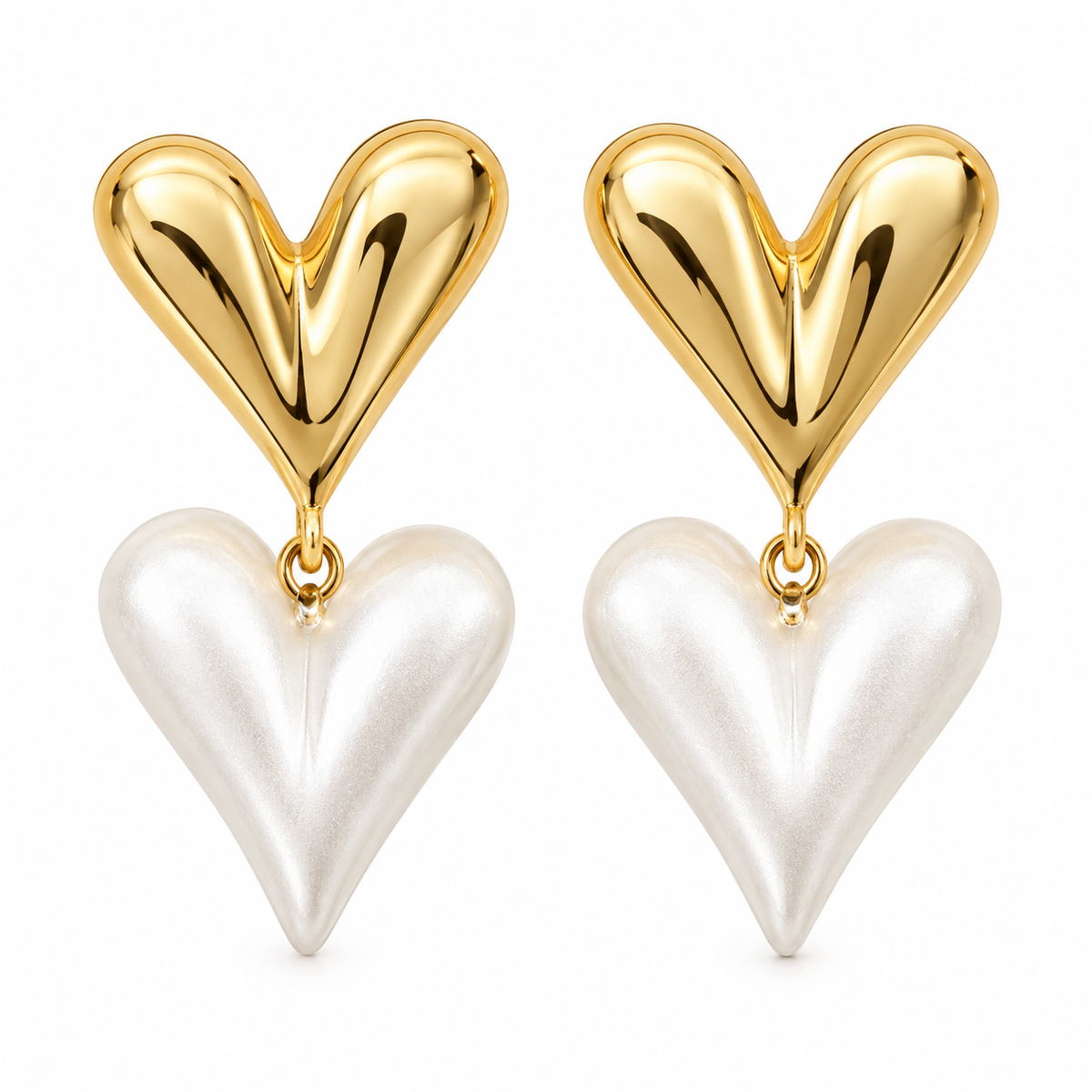 A pair of heart-shaped drop earrings, each featuring a polished gold top heart and a larger pearlescent white bottom heart, shown on a clean white background.
